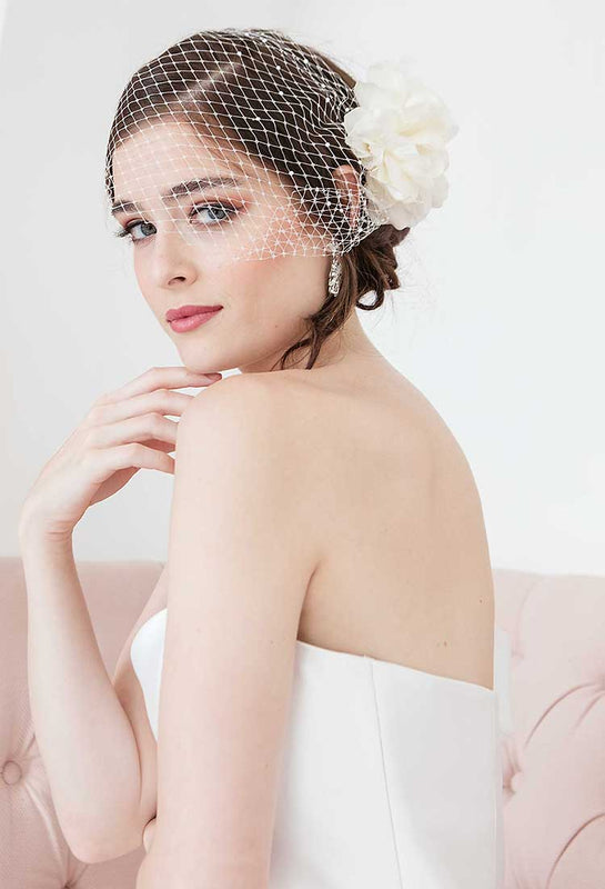 woman wearing birdcage face veil and floral hair comb from the Flora Collection by Laura Jayne Accessories