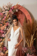 Bride wearing Aurelie Glitter Fingertip Veil in rose gold by Laura Jayne.