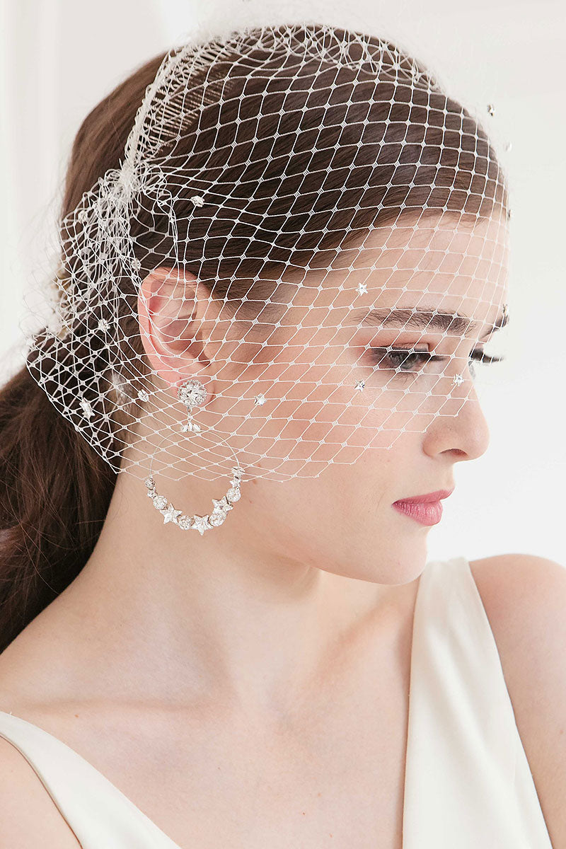 Profile closeup of bride wearing birdcage veil with crystal stars Nova by Laura Jayne