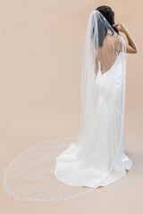 Back view portrait of bride wearing cathedral veil with nature-inspired leaf embroidery Laurella VE8007 by Laura Jayne Accessories