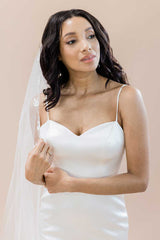 Half portrait of bride wearing cathedral veil embroidered with leaves Laurella by Laura Jayne Accessories Toronto