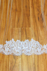 cathedral wedding veil featuring a train framed in a rich pattern of rose genuine French Alencon lace. Sheer light illusion flows effortlessly into the bold statement train to add a timeless modern sensuality to your w-day look!