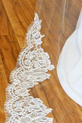 cathedral wedding veil featuring a train framed in a rich pattern of rose genuine French Alencon lace. Sheer light illusion flows effortlessly into the bold statement train to add a timeless modern sensuality to your w-day look!