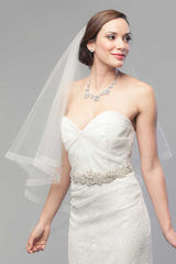 Bride wearing Laura Jayne V2006 Denyse bridal veil with horsehair trim. Handmade in Canada.