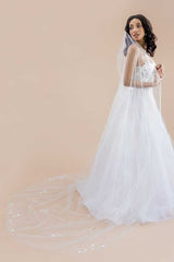 Full side view of a modern romantic bride's cathedral length train with beaded Japanese style flower blossoms. Monet Beaded Blossom Cathedral Veil. Laura Jayne Accessories Toronto. Made in Canada.