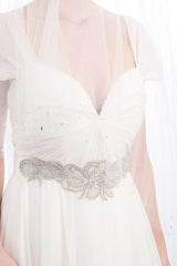 Torso of woman wearing Estelle metallic floral sash by Laura Jayne Accessories