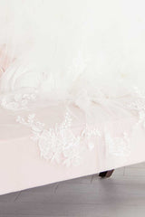 Close up view of Indra Cathedral Veil's hand embroidered floral details.