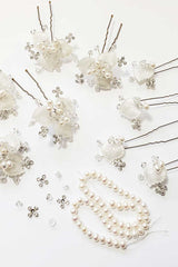 Laura Jayne Silver leaf bridal hairpins on work table