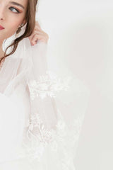 Modern romantic bride wearing heirloom worthy Laura Jayne Khrysia Monogram Cathedral Veil with hand beaded floral embroidery details. Made in Toronto, Canada..