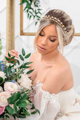 Boho romantic modern bride wearing a low bun with a stack of 3 skinny crystal headbands including Syrena Graduated Crystal Headband. Handcrafted by Laura Jayne Accessories in Toronto, Canada.