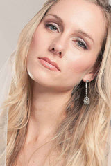 woman wearing crystal pendant pear drop earring
