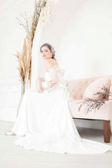 Toronto bride wearing on trend birdcage face veil with beautiful ivory netting. Manon Birdcage Veil by Laura Jayne Accessories Toronto. Handcrafted in Canada.