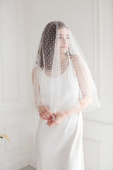 Toronto Bride in fingertip length polka dot veil. Handmade in Canada. Bridal Fashion Trend.