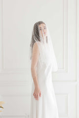 Toronto Bride in fingertip length polka dot veil. Handmade in Canada. Bridal Fashion Trend.