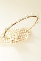 Top view of the Syrena Graduated Pearl Headband with crystals. Skinny bridal accessory handmade in Canada by Laura Jayne Accessories Toronto.