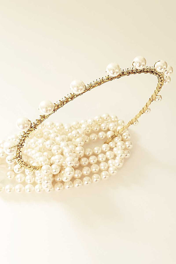  Top view of the Syrena Graduated Pearl Headband with crystals. Skinny bridal accessory handmade in Canada by Laura Jayne Accessories Toronto.