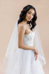 Profile of bride wearing drop cathedral horsehair veil. Heather by Laura Jayne Accessories