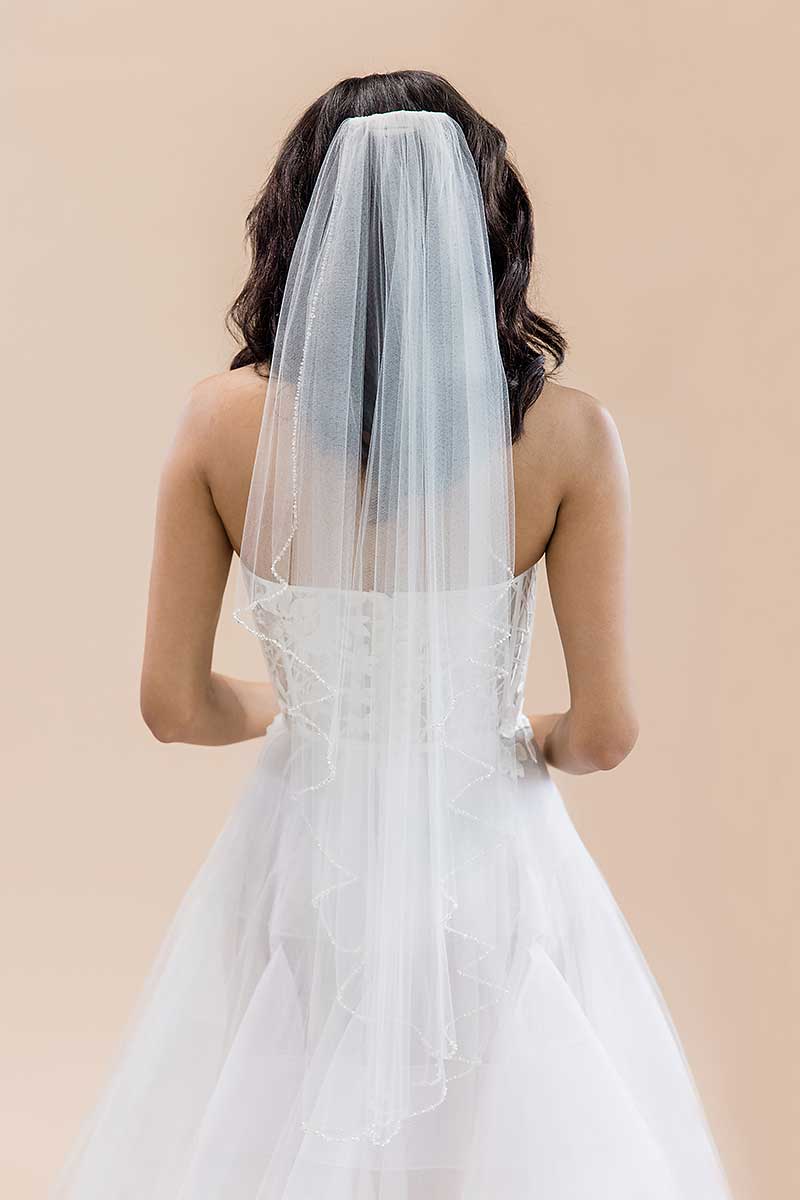 Back view of bride wearing Laura Jayne Dea fingertip beaded veil. Handcrafted in Toronto, Canada.