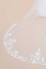 Closeup of border on floral embroidered cathedral veil with crystals and pearls. Nera 3D Flower Cathedral Veil by Laura Jayne Accessories Toronto. Handcrafted in Canada.