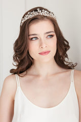 Romantic modern bride wearing crystal and pearl bridal crown with open lattice of flowers on an organza wrapped headband in rose gold tone. Adrienne Bridal Tiara. Handmade in Canada by Laura Jayne Accessories Toronto.