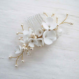 White and gold floral crystal and pearl bridal hair comb accessory.