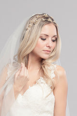 woman wearing gold double headband