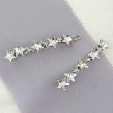Pair of celestial crystal star barrettes by Laura Jayne Accessories