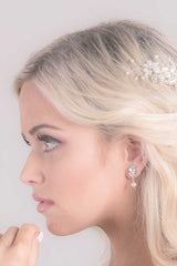 woman with pearl drop earring profile view