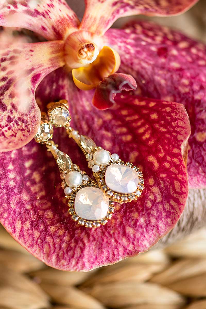 Rose blush crystal and pearl dangle bridal earring. Handmade in Toronto wedding jewelry. Dramatic bridal earring trend. Earrings as featured in wedluxe magazine.
