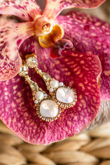 Rose blush crystal and pearl dangle bridal earring. Handmade in Toronto wedding jewelry. Dramatic bridal earring trend. Earrings as featured in wedluxe magazine.