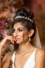 Rose blush crystal and pearl dangle bridal earring. Handmade in Toronto wedding jewelry. Dramatic bridal earring trend. Earrings as featured in wedluxe magazine.