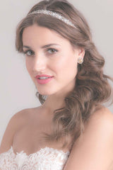 bride wearing Chelle crystal beaded tulle wedding headband handcrafted by Laura Jayne Accessories