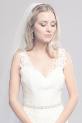 Bride wearing Verde gold leaf wedding belt by Laura Jayne