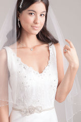 Bride wearing veil and Lourdes bridal sash by Laura Jayne Accessories