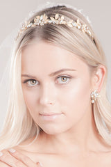 Closeup of boho chic bride wearing nature-inspired, whimsical low profile tiara with leaves and pearls. Bliss Leaf Pearl Tiara. Handcrafted in Canada by Laura Jayne Accessories Toronto.