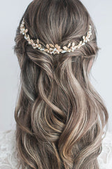 Back view of modern bride wearing hair half up half down with pearl and leaf tiara worn as a reverse crown. Bliss Leaf Pearl Tiara. Handcrafted in Canada by Laura Jayne Accessories Toronto.