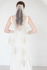 Back view of bride wearing tropical inspired Isla Gold Floral Waltz Wedding Veil with lush metallic organza blooms. Laura Jayne Accessories Toronto. Handcrafted in Canada.