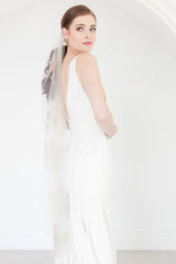 Side profile of minimalist bride wearing floral embroidered waltz length veil with gold metallic edging. Isla Gold Floral Waltz Wedding Veil by Laura Jayne. Made in Toronto, Canada.