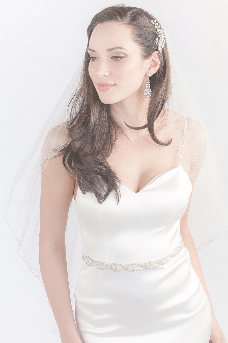 Modern romantic bride wearing fingertip length blusher veil by Laura Jayne. Corsica Two Tier Fingertip Veil made in Toronto, Canada.