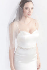 Minimalist bride wearing a modern, chic fingertip length bridal veil with crystal details. Dana Fingertip Veil by Laura Jayne Accessories Toronto. Handcrafted in Canada.