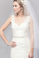 Profile of modern romantic bride with head turned to side wearing a timeless classic two-tier cathedral wedding veil. Mae Cathedral Veil with blusher handcrafted in Canada by Laura Jayne Accessories Toronto.