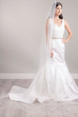 Full length view of a modern romantic bride wearing a cathedral veil with crystals and "Love" monogram. Cherish Crystal Cathedral Veil made in Canada by Laura Jayne Accessories Toronto.