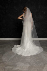 Back view portrait of bride wearing pearl beaded cathedral veil Alayna by Laura Jayne Accessories