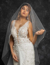 bodice of bride wearing pearl beaded cathedral drop veil Alayna by Laura Jayne Accessories