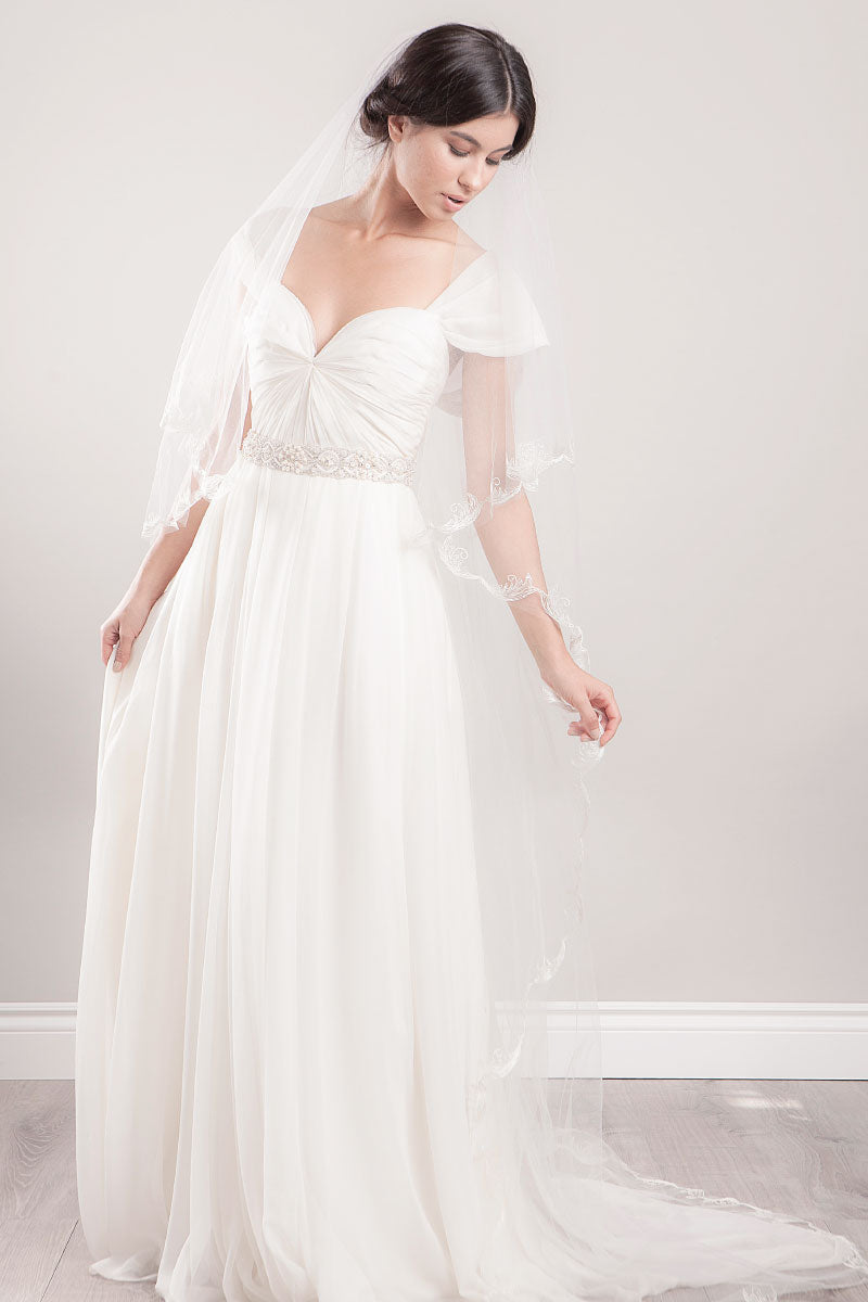 Portrait of bride looking down wearing embroidered chapel veil Sydney by Laura Jayne