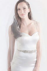 Minimalist bride wearing classic yet modern Lavinia fingertip wedding veil by Laura Jayne Accessories Toronto. Handcrafted in Canada.