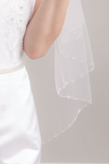 Close up of crystal trim detail on Leanna Crystal Edge Chapel Veil by Laura Jayne. Made in Toronto, Canada.