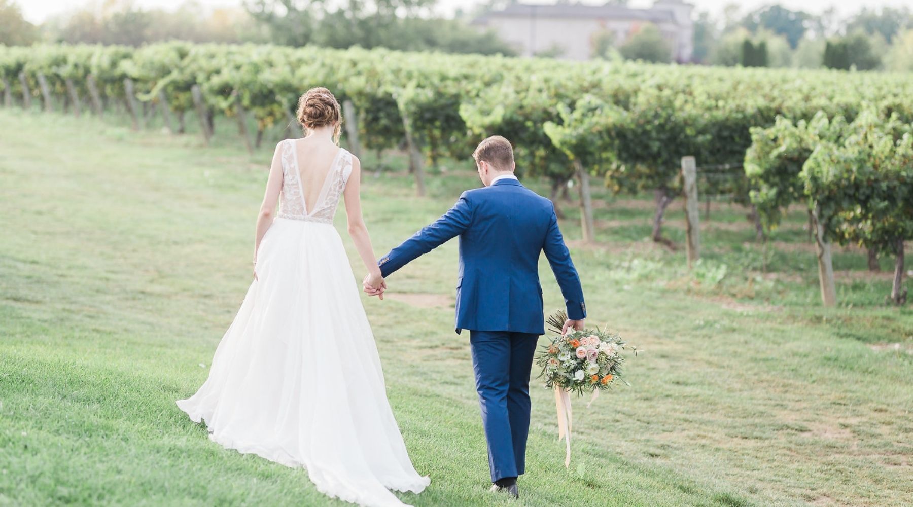 happy bride and groom walking outdoors 