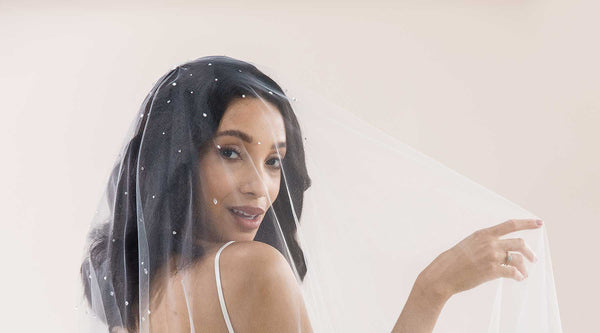 Bride with blusher veil over her face Laura Jayne V8024 Rain