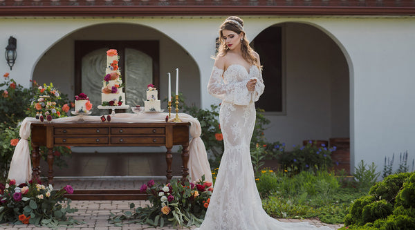 Bride and sweet table at outdoor Spanish inspired wedding
